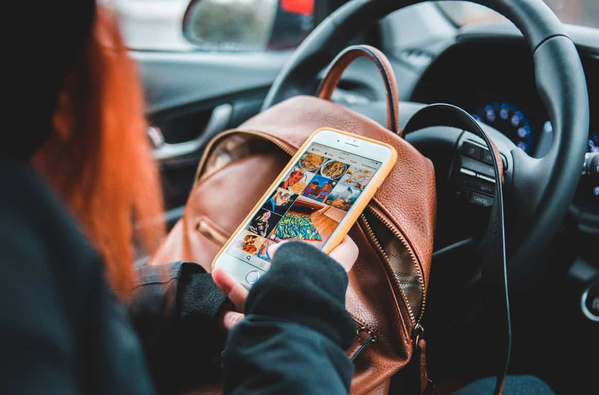 Jacksonville customer scrolling Facebook and Instagram on a smartphone