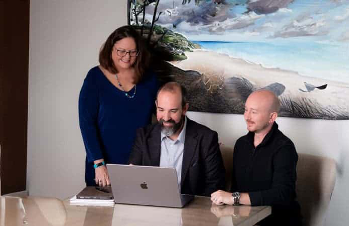 MasterBrand Studio team reviewing Jacksonville SEO strategy in the conference room